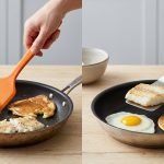 A hyper-realistic studio photo showing two kitchen scenes on a light counter. On the left, a thick red plastic spatula is next to a pan with a ruptured egg, torn pancake, and mangled fish. On the right, a sleek, thin stainless steel fish turner is beside a pan with a perfectly intact egg, smooth pancake, and undamaged fish, illustrating the tools' impact on delicate food.